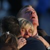 The families of victims grieve near Sandy Hook Elementary School, where a gunman opened fire on school children and staff in Newtown, Connecticut