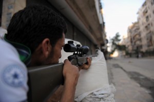A fighter from the Syrian opposition aim